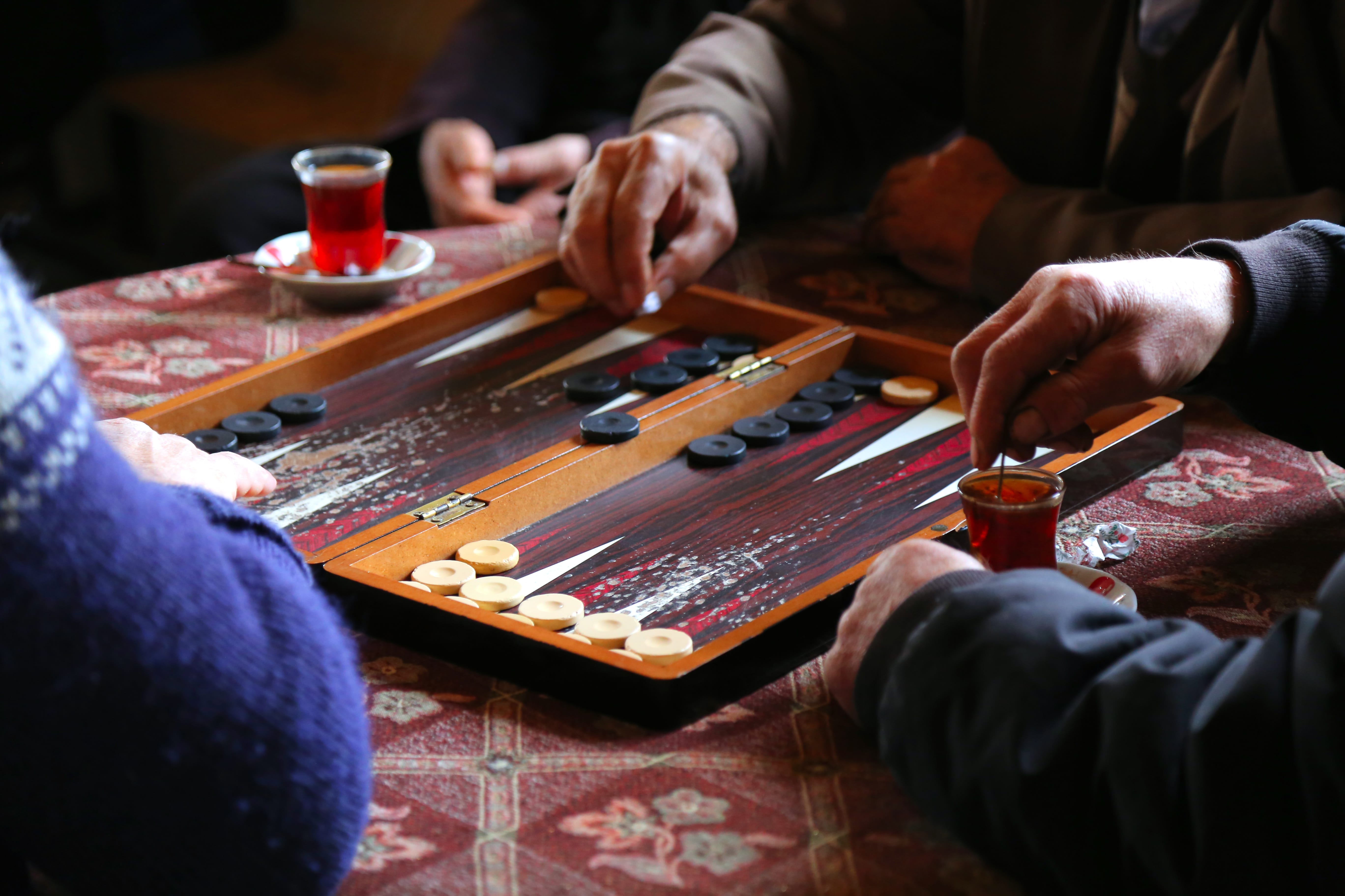 A group of people playing backgammon